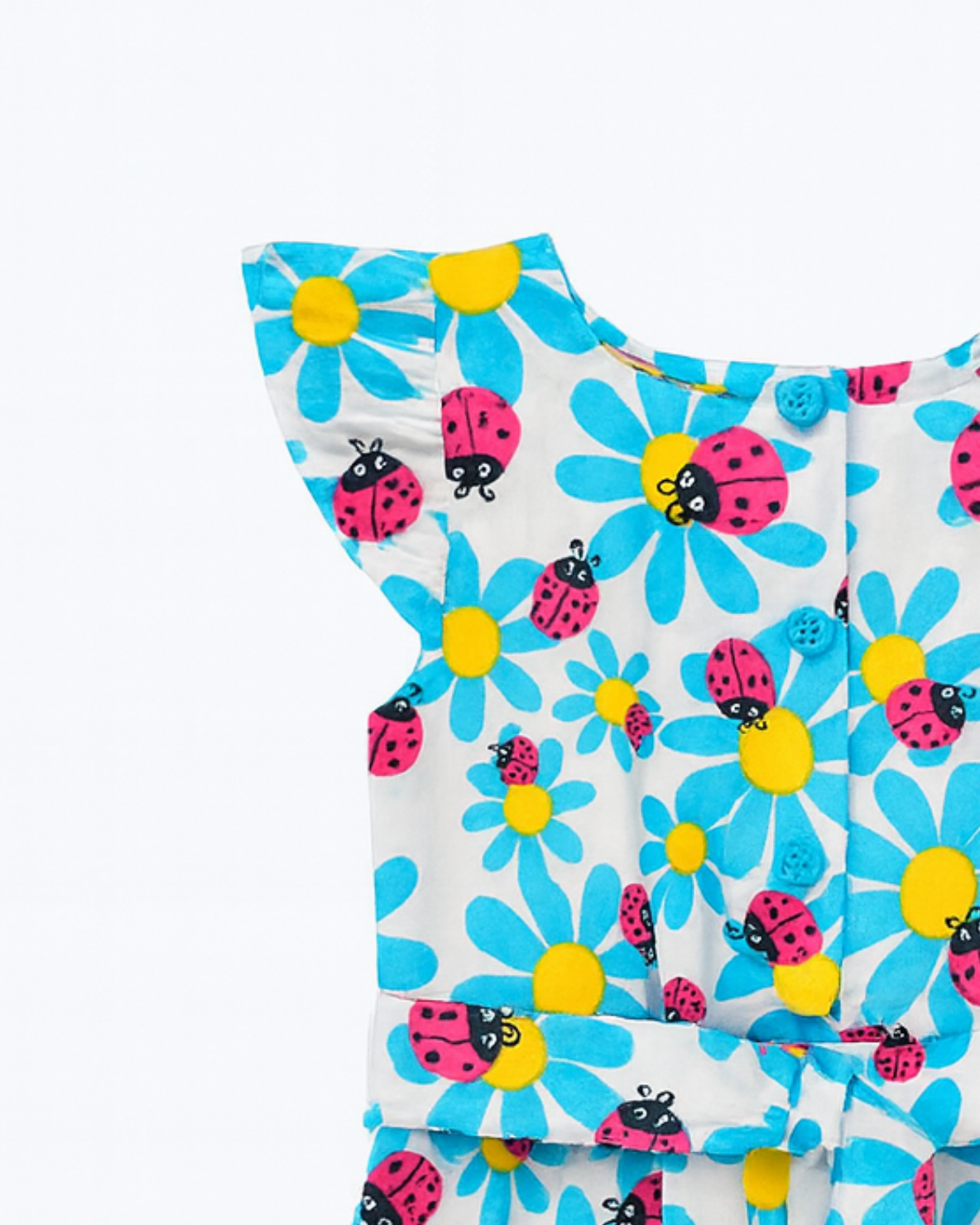 Enterizo blanco con estampado de flores y mariquitas