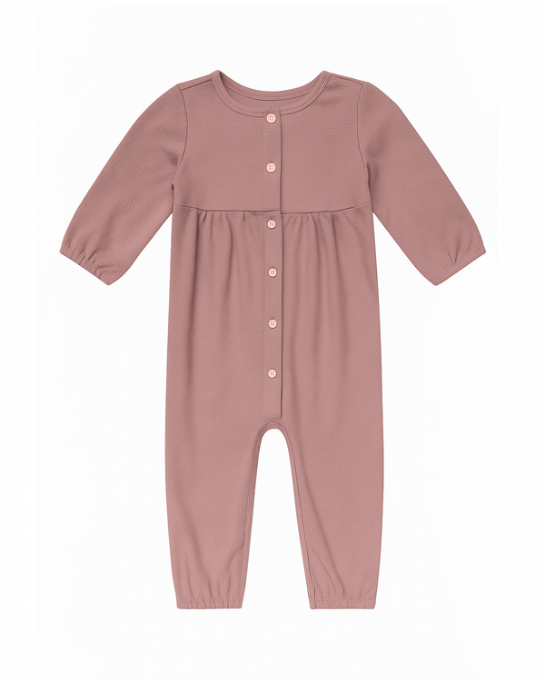 Enterizo rosa con botones frontales