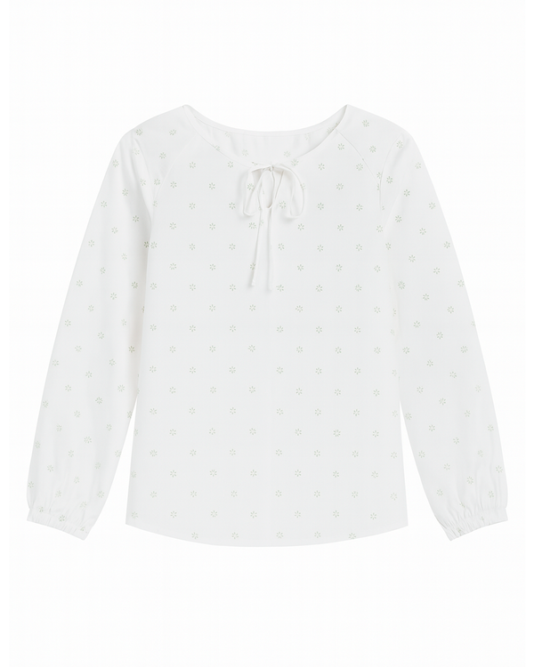 Blusa blanca con lazo en el escote y estampado floral