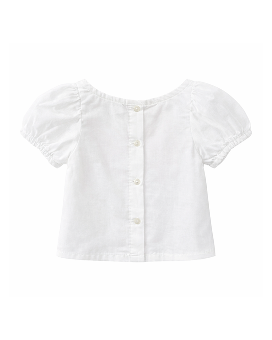 Blusa Niña Blanca con Moño Frontal Rosado